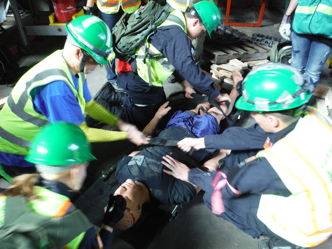 Central Aid Agency Emergency Response personnel attend to a 