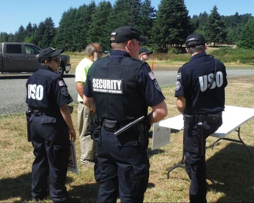 USO Security Agents attend a briefing prior to going on duty at an event.