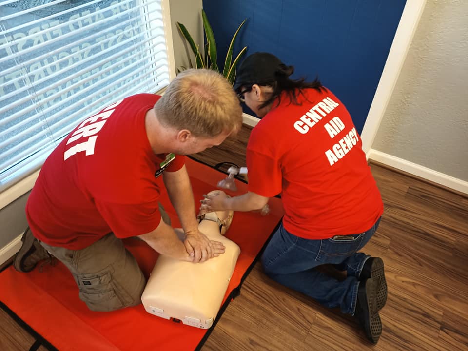 Personnel practicing CPR.