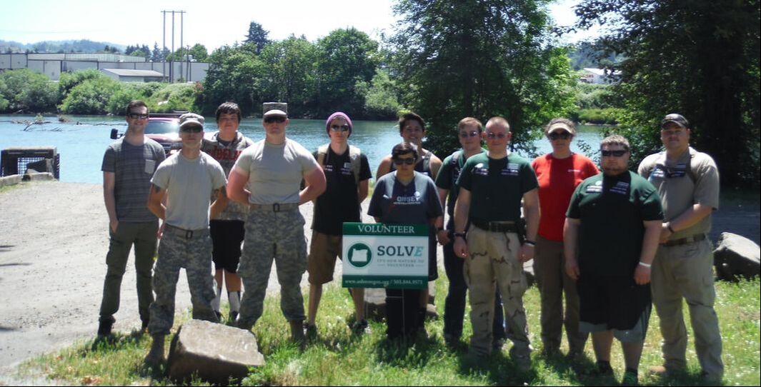 Personnel helped clean up the shores of the Willamette River.