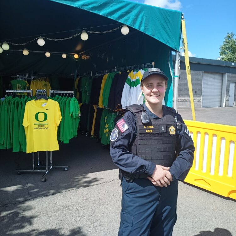 Female USO Agent on duty outside during a UO Home Game at Autzen Stadium.